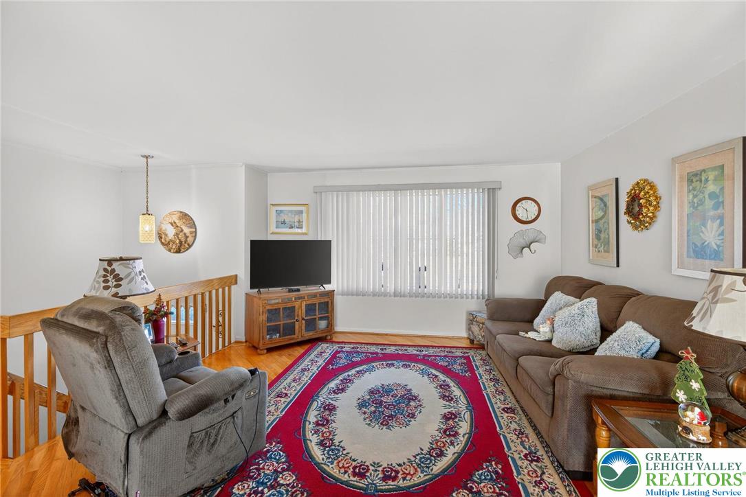 5424 Clauser Road Orefield, PA 18069 - Photo 6 of 31 a living room with furniture and a flat screen tv