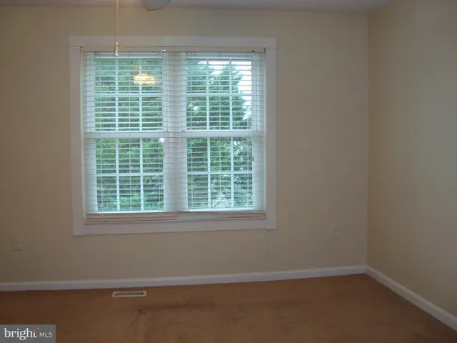 a view of a room that has a window in it