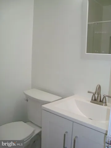 a bathroom with a sink a toilet