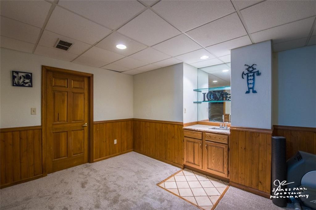 6148 Baker School Road Trafford, PA 15085 - Photo 22 of 25 Lower level Game room with Sink. Door leads into large Laundry room with Walk out to backyard!