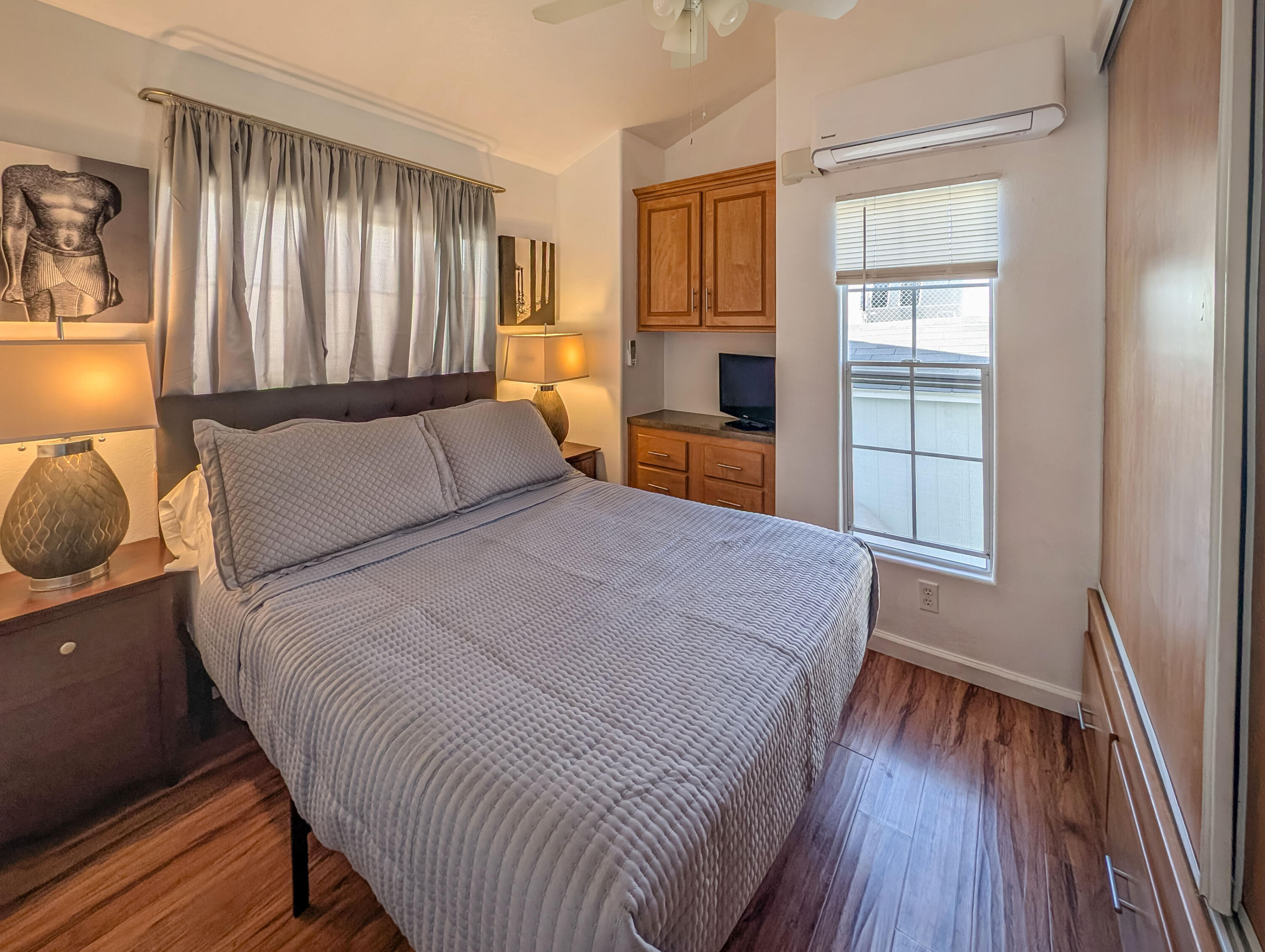 70200 Dillon Road, Unit 425 Desert Hot Springs, CA 92241 - Photo 13 of 28 a bedroom with a large bed and a window