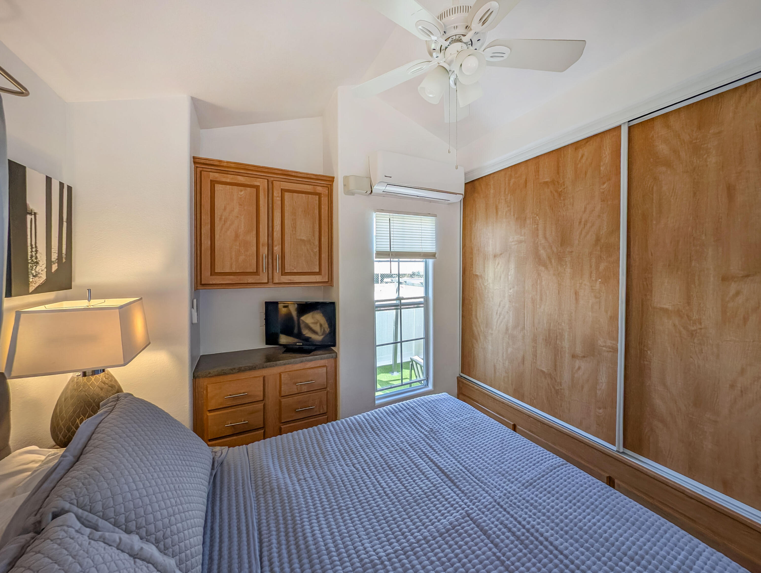 70200 Dillon Road, Unit 425 Desert Hot Springs, CA 92241 - Photo 14 of 28 a bedroom with furniture and window