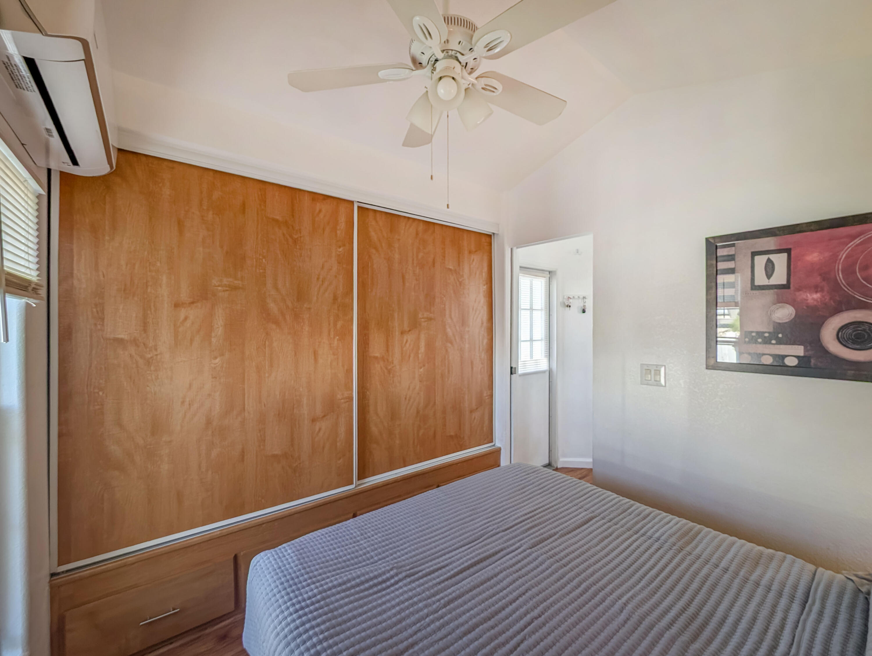 70200 Dillon Road, Unit 425 Desert Hot Springs, CA 92241 - Photo 15 of 28 a view of a room with wooden floor and fan