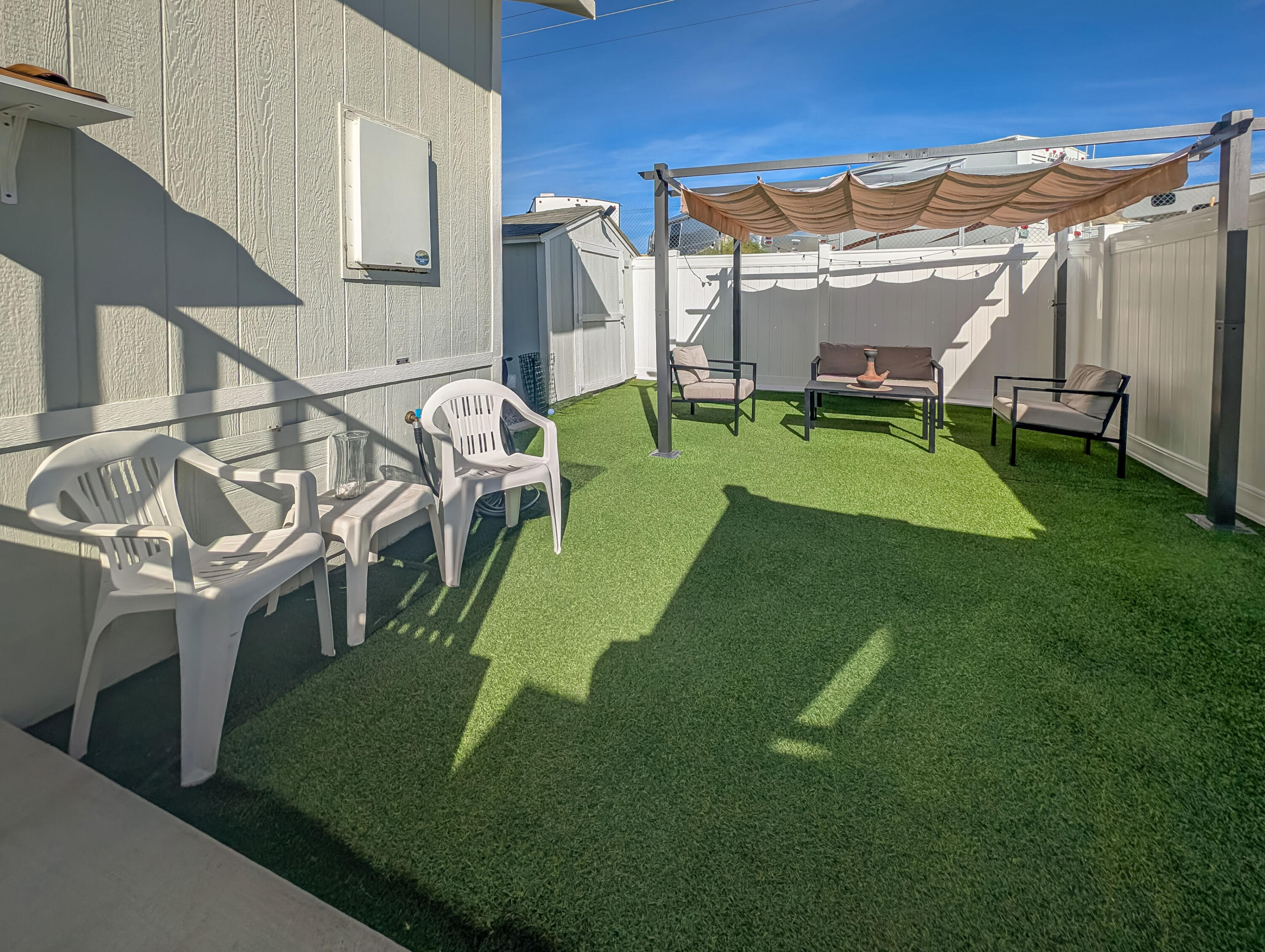 70200 Dillon Road, Unit 425 Desert Hot Springs, CA 92241 - Photo 18 of 28 a view of a house with backyard and porch