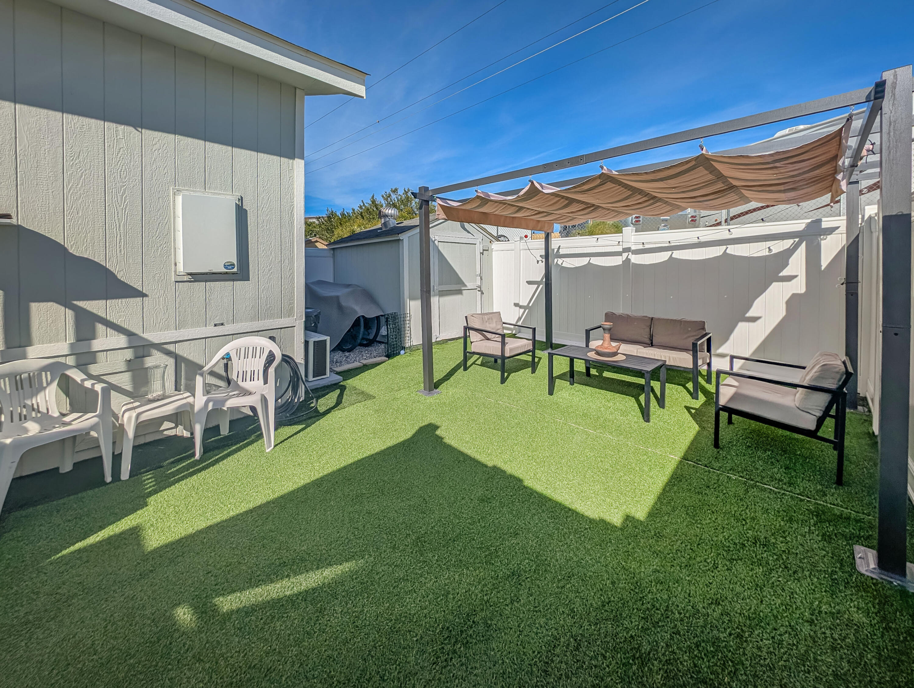 70200 Dillon Road, Unit 425 Desert Hot Springs, CA 92241 - Photo 19 of 28 a view of a house with backyard