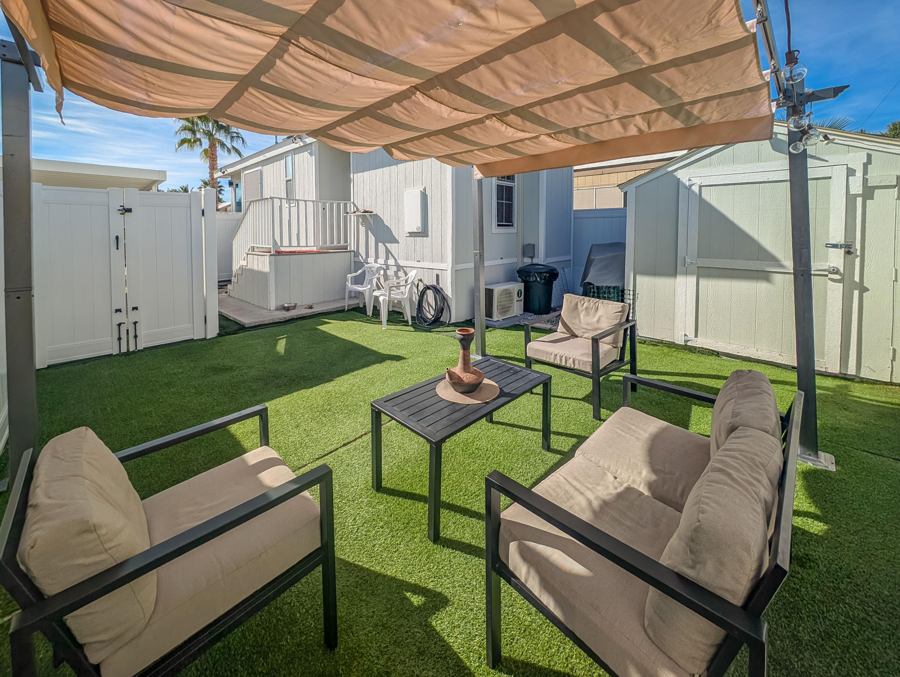 70200 Dillon Road, Unit 425 Desert Hot Springs, CA 92241 - Photo 20 of 28 a patio with yard a view of a living room and a patio