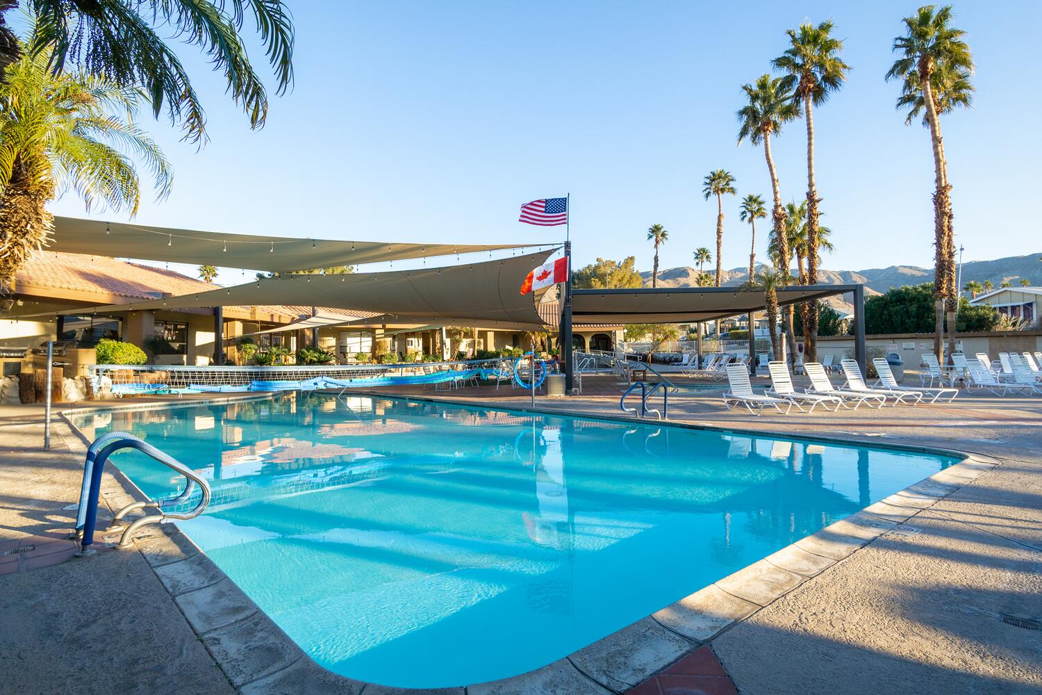 70200 Dillon Road, Unit 425 Desert Hot Springs, CA 92241 - Photo 24 of 28 a view of a swimming pool with outdoor seating