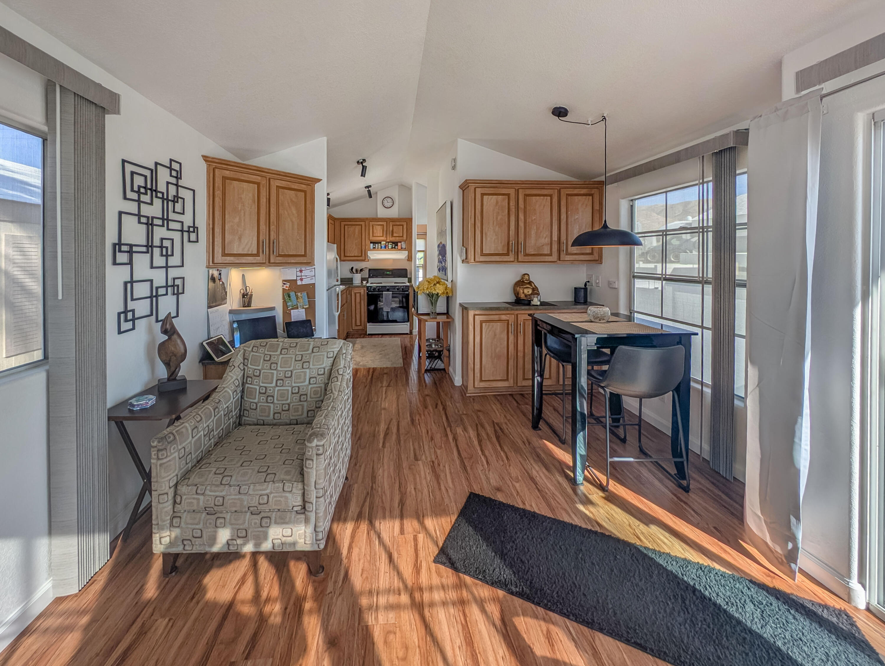 70200 Dillon Road, Unit 425 Desert Hot Springs, CA 92241 - Photo 6 of 28 a living room with furniture and a wooden floor