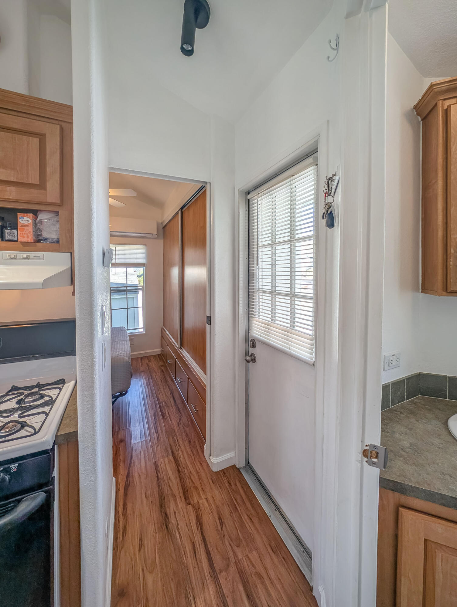 70200 Dillon Road, Unit 425 Desert Hot Springs, CA 92241 - Photo 10 of 28 a room with wooden floor and furniture