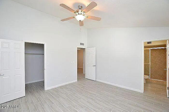 6431 East Sandra Terrace Scottsdale, AZ 85254 - Photo 7 of 19 wooden floor in an empty room with a window