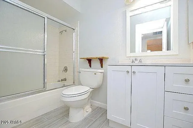 a bathroom with a toilet and a sink