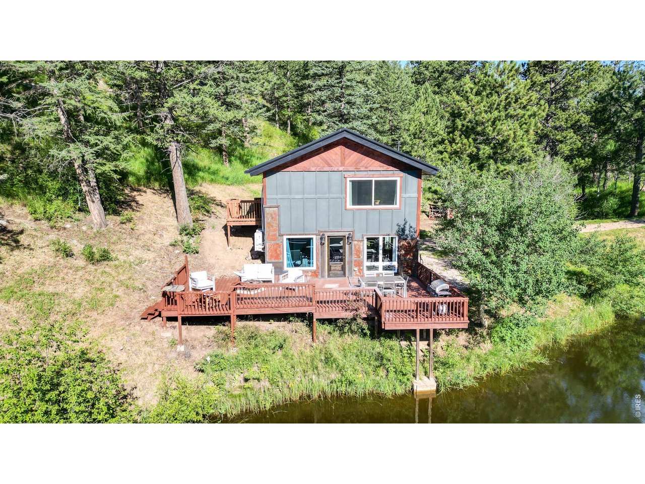 1268 Spring Valley Road Bellvue, CO 80512 - Photo 7 of 33 a balcony with furniture and garden
