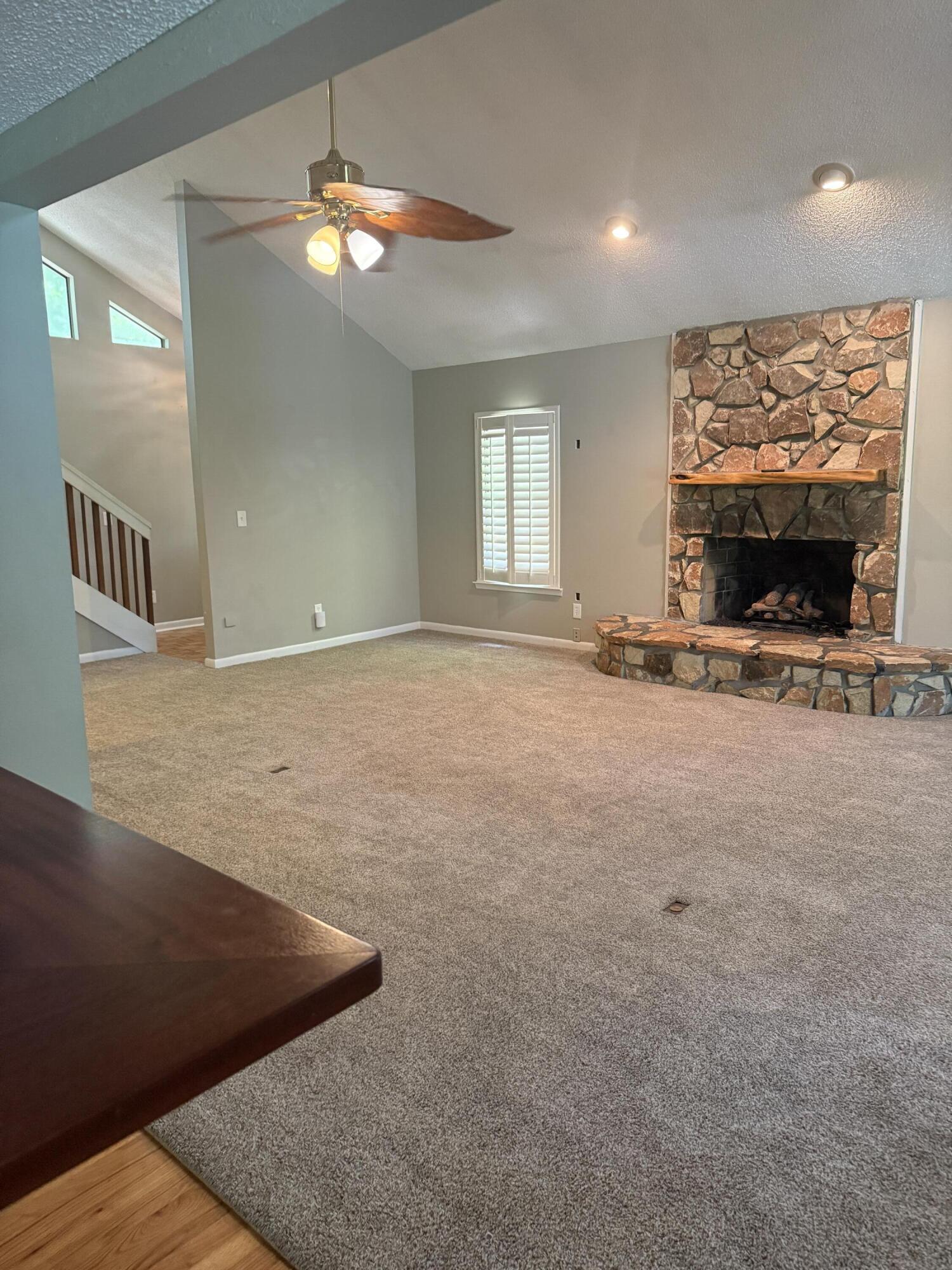 504 Main Street Destin, FL 32541 - Photo 12 of 25 a view of an empty room with a fireplace and a window