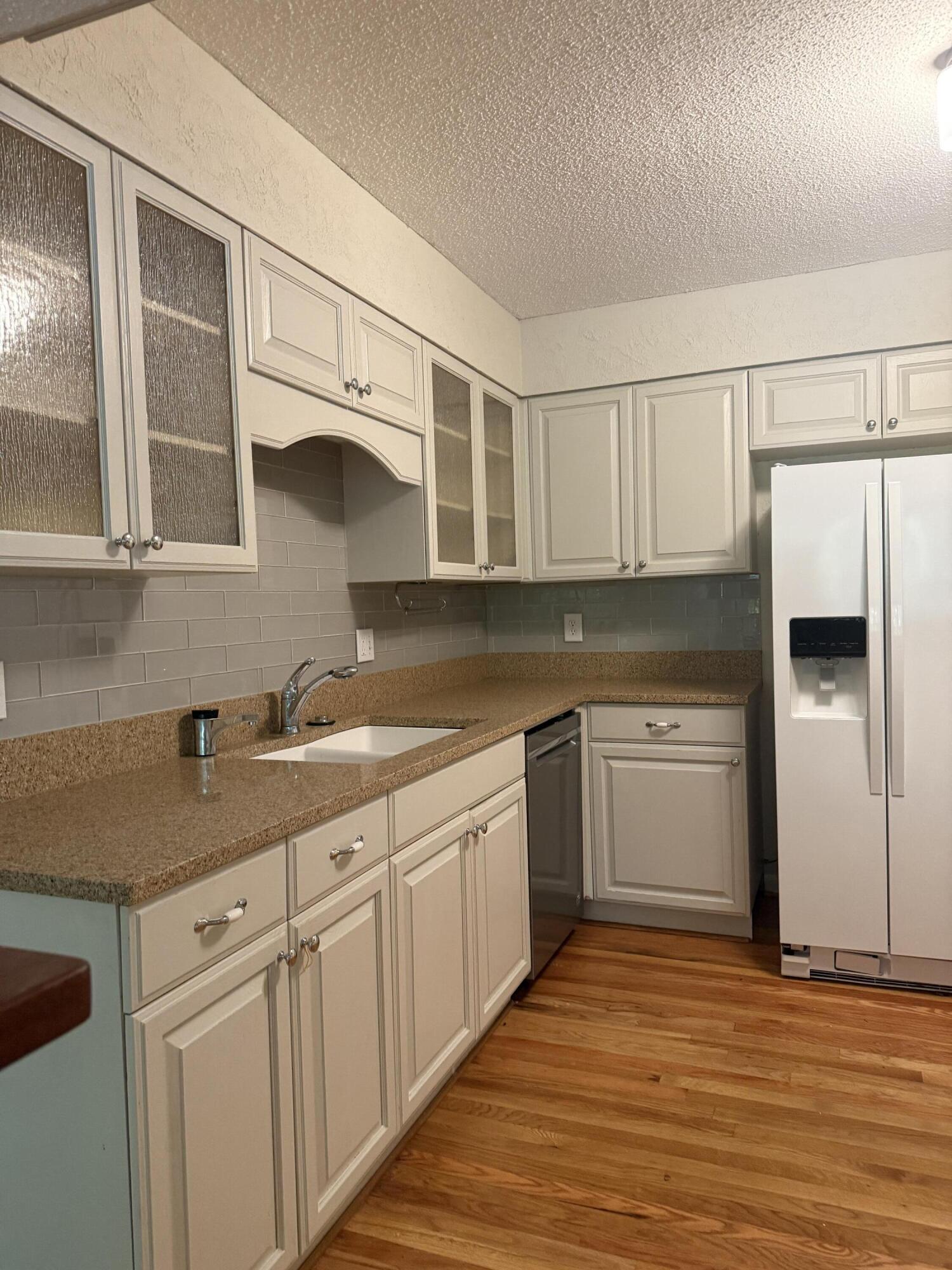 504 Main Street Destin, FL 32541 - Photo 15 of 25 a kitchen with a sink cabinets and window