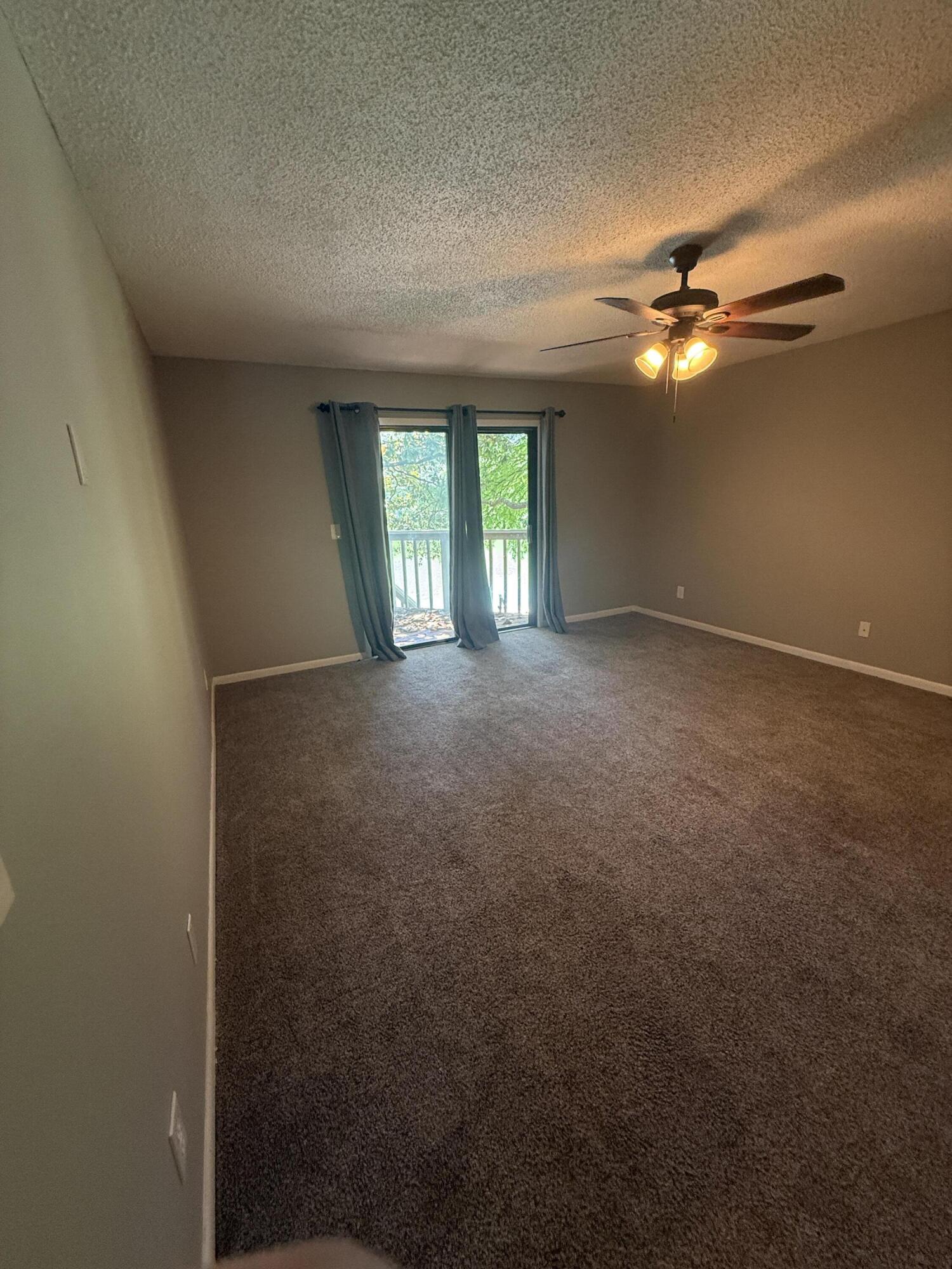 504 Main Street Destin, FL 32541 - Photo 18 of 25 a view of empty room with windows and ceiling fan
