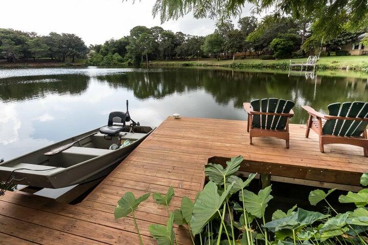 504 Main Street Destin, FL 32541 - Photo 4 of 25 a view of a lake with a table and chairs