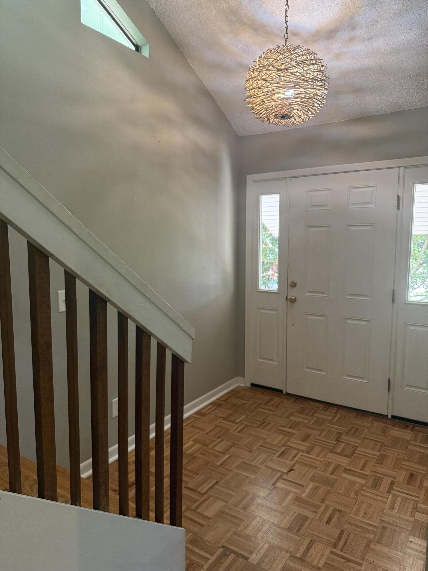 504 Main Street Destin, FL 32541 - Photo 9 of 25 a view of entryway with wooden floor