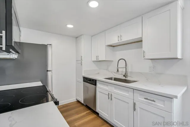a kitchen with a sink and cabinets