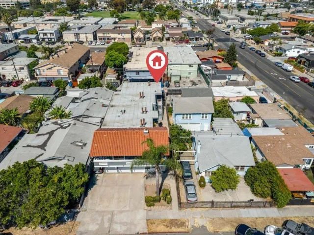 an aerial view of residential houses with outdoor space