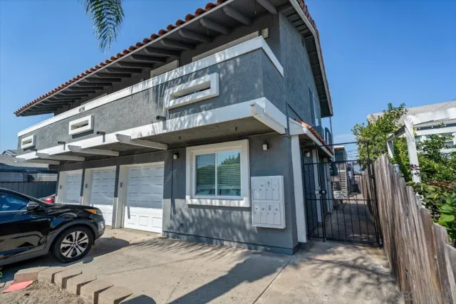 a view of a car park in front of house