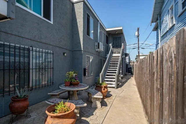 a view of a patio with couple of chairs