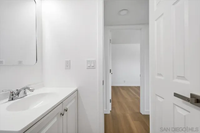 a bathroom with a sink and mirror