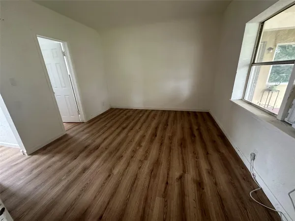 a view of wooden floor in an empty room