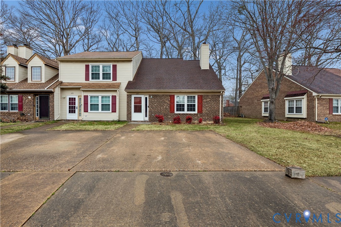 377 Kinsmen Way Hampton, VA 23666 - Photo 1 of 30 a front view of a house with a garden