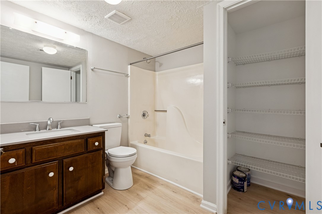 377 Kinsmen Way Hampton, VA 23666 - Photo 12 of 30 a bathroom with a granite countertop sink toilet and shower
