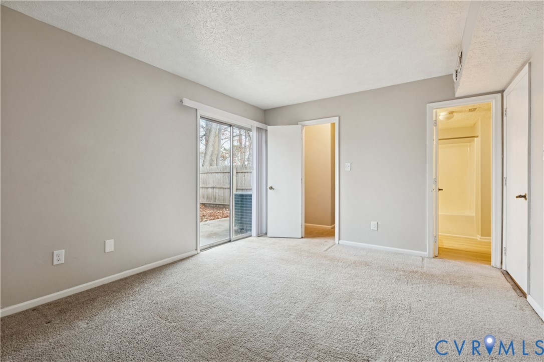 377 Kinsmen Way Hampton, VA 23666 - Photo 15 of 30 a view of an empty room with window and bathroom