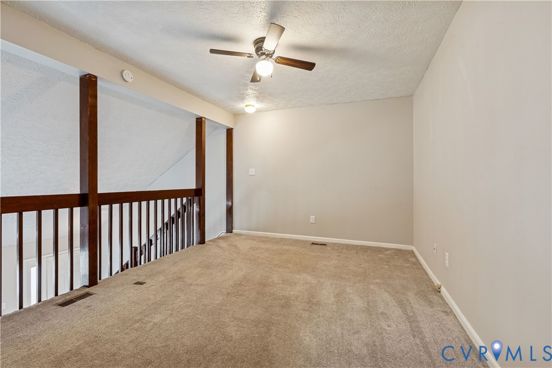 377 Kinsmen Way Hampton, VA 23666 - Photo 19 of 30 a view of a livingroom with a ceiling fan and window