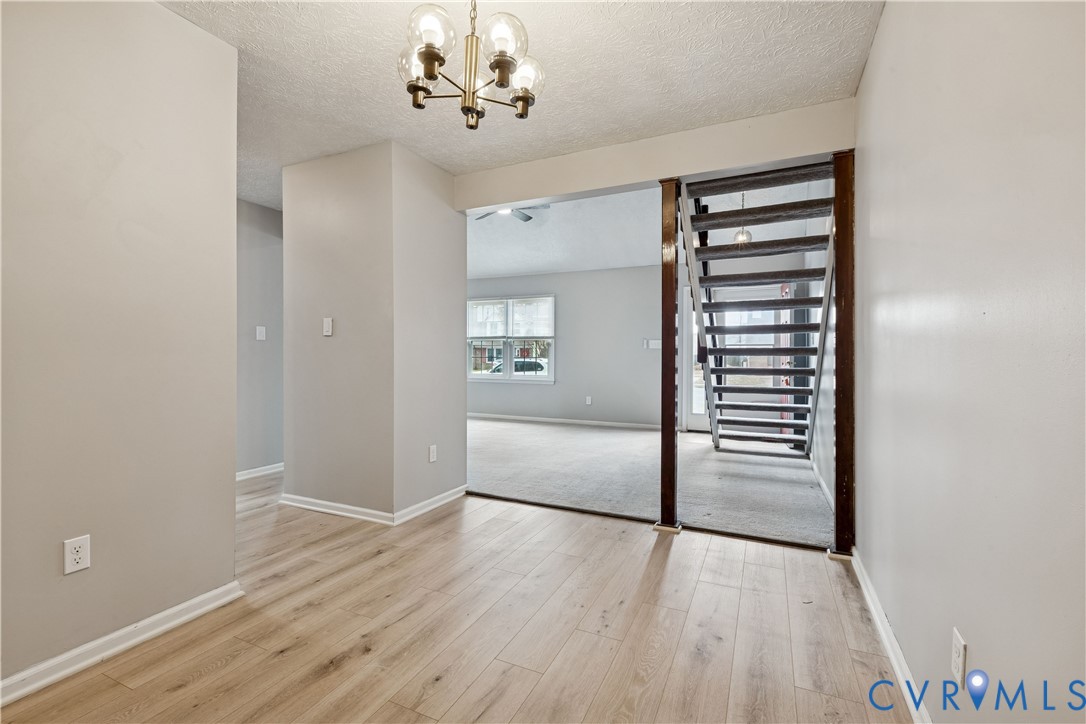 377 Kinsmen Way Hampton, VA 23666 - Photo 8 of 30 wooden floor in an empty room with a window