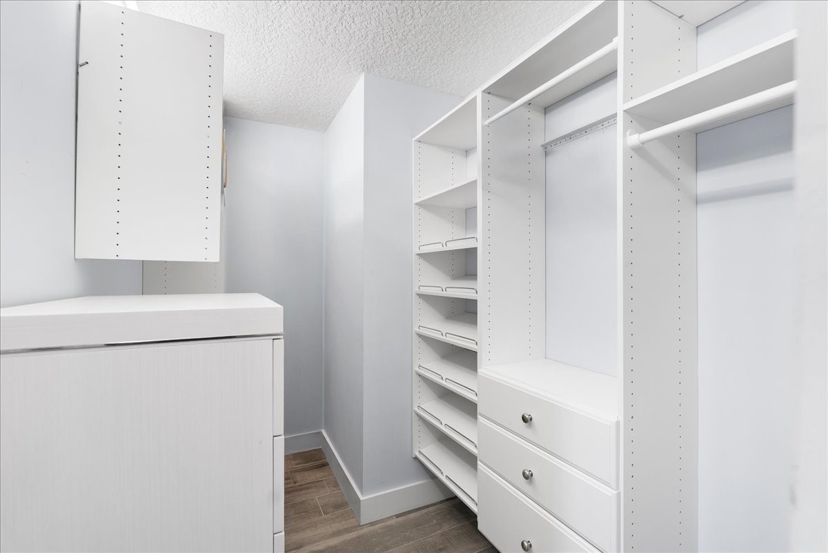 85316 Avant Road Yulee, FL 32097 - Photo 30 of 62 a view of walk in closet with empty racks