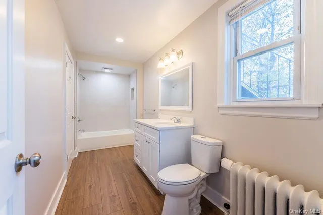 a bathroom with a sink toilet tub and shower