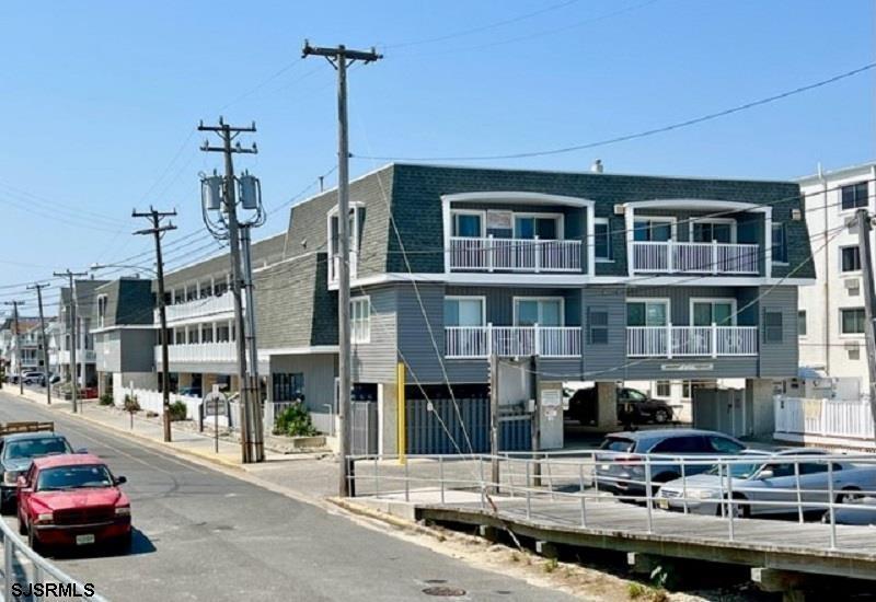 853-71 Plymouth Place, Unit 13 Ocean City, NJ 08226 - Photo 1 of 6 a car parked in front of a building
