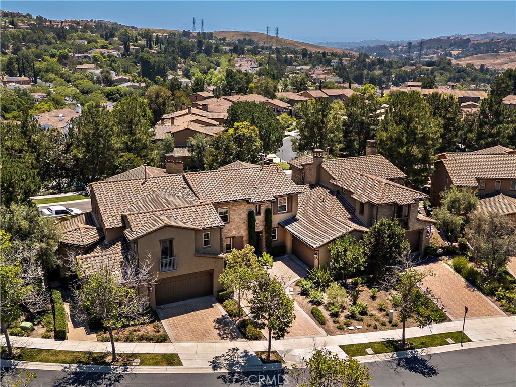 47 Tuscany Ladera Ranch, CA 92694 - Photo 25 of 28 an aerial view of multiple houses with a street
