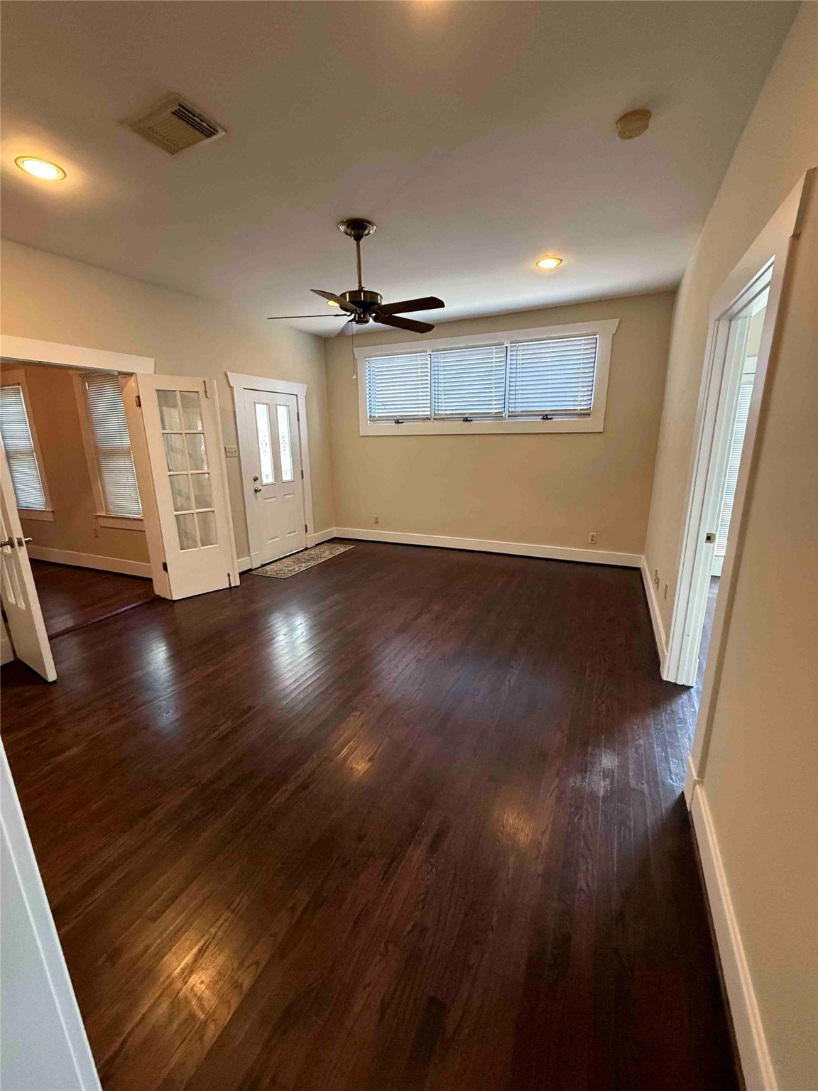 604 East 17th Street Houston, TX 77008 - Photo 12 of 28 an empty room with wooden floor and windows