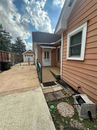 a view of backyard with barbeque grill stove and outdoor seating