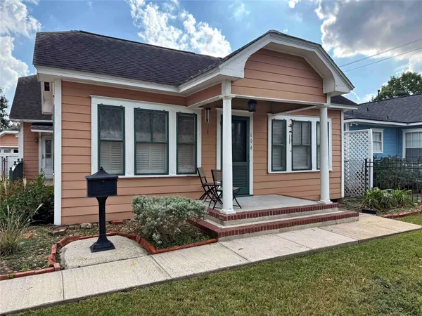a front view of a house with yard