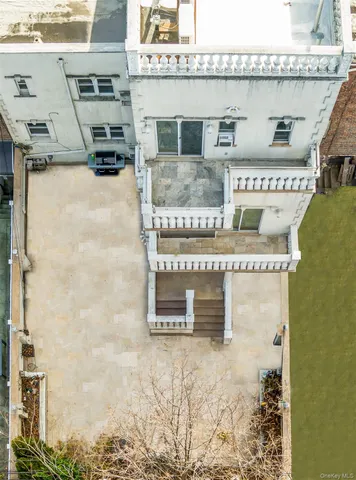 an aerial view of a backyard with outdoor seating