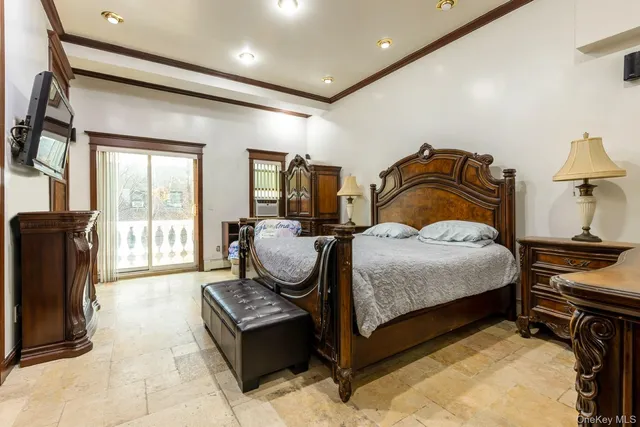 a bedroom with bed and wooden floor