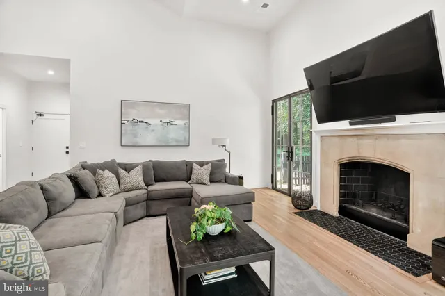 a spacious bedroom with a bed and a fireplace