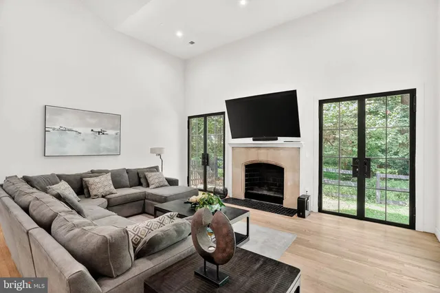 a spacious bedroom with a bed and a fireplace