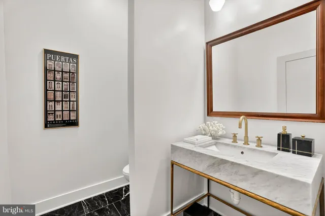 a bathroom with a sink and a window