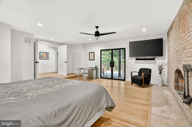 a bedroom with two beds and a window with outer view
