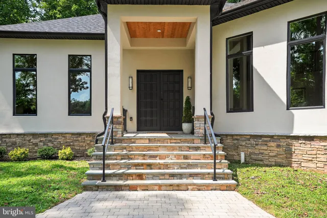 a large kitchen with stainless steel appliances granite countertop a sink stove and refrigerator