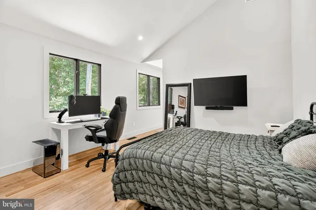 a view of a patio with a dining table and chairs with wooden floor