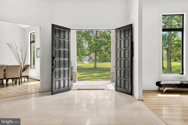 a kitchen with a sink a center island a counter space and a window