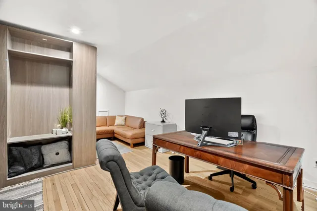 a front view of a house with a garden and porch