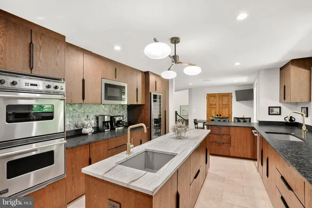 a kitchen with a table and chairs in it